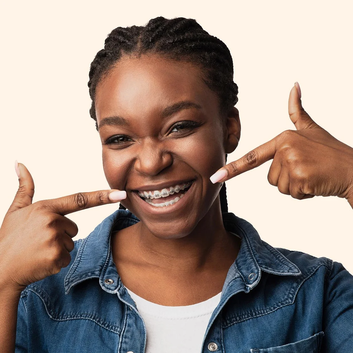 A lady laughing after the braces in her teeth